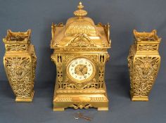 19th century presentation brass clock garniture (clock ht 41cm)