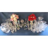 Large collection of glass and crystal items including several glass swans, vases, jars etc