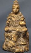19th century bronze model of Guanyin seated upon rockwork, signed to underside 7.5cm