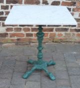 Marble top table on a cast iron base