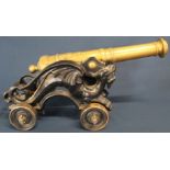 Brass & cast metal model canon with stylised dragon supports 46cm wide 21.5cm high