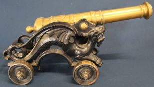 Brass & cast metal model canon with stylised dragon supports 46cm wide 21.5cm high