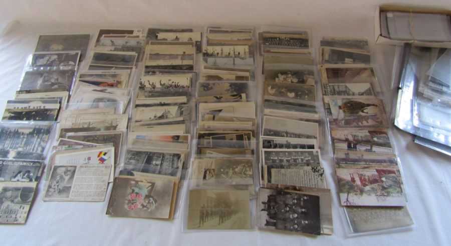Collection of military themed postcards and sleeves