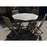 Folding wooden garden table & 4 chairs (one with broken back support)