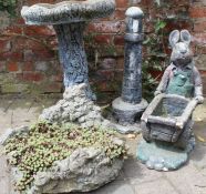 Selection of garden ornaments including a bird bath, lighthouse, rabbit & planter