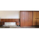 Retro teak bedroom suite by White & Newton comprising 2 wardrobes & a bed headboard