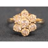 18ct gold diamond daisy ring set with seven brilliant cut diamonds, total 1.75ct, clarity SI, colour