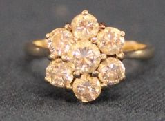 18ct gold diamond daisy ring set with seven brilliant cut diamonds, total 1.75ct, clarity SI, colour