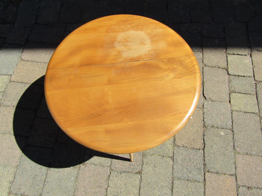 Small Ercol drop leaf table in light elm approx. 40cm high & 60cm diam. - Image 2 of 3