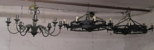 2 gothic style iron hanging ceiling lights and a metal 6 arm chandelier type light fitting