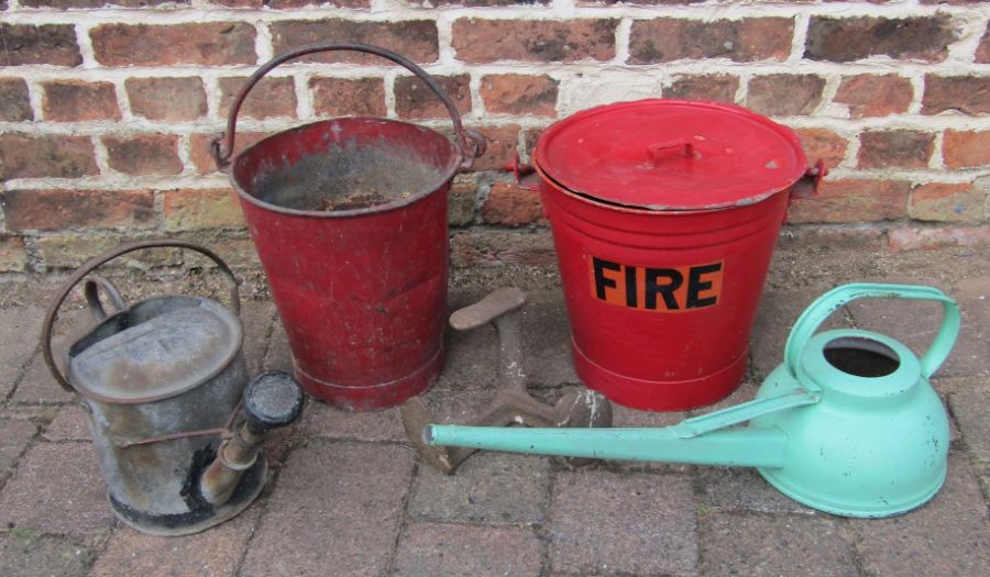 Fire buckets one with lid, watering cans and shoe last