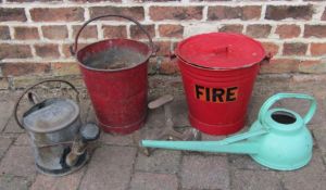 Fire buckets one with lid, watering cans and shoe last