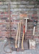 Various garden tools including axes, shovels, fork etc
