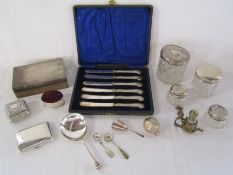Collection of silver to include dressing table bottles with silver lids, silver cigarette case,