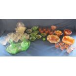 Carnival glass, green glass including dressing table tray and glass cups and saucers