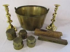 Brass jam pan, candle sticks, large threaded stop caps and a wood and brass level still with