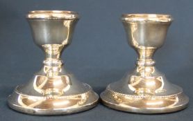 Pair of silver candlesticks with loaded bases Birmingham 1968