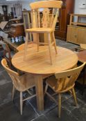 Circular to oval oak draw leaf table with 4 pine farmhouse style chairs approx. dia 110cm