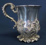 Victorian silver cup with heavy embossed foliage & foot with gilt interior, the base marked TRW,
