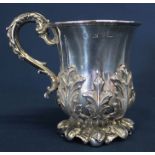 Victorian silver cup with heavy embossed foliage & foot with gilt interior, the base marked TRW,