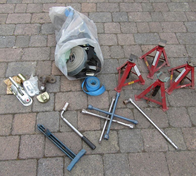 2 pairs of axle stands, a bag of mixed ratchets and straps, towing hitch and wheel braces etc