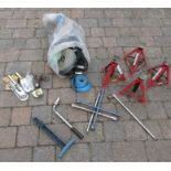 2 pairs of axle stands, a bag of mixed ratchets and straps, towing hitch and wheel braces etc