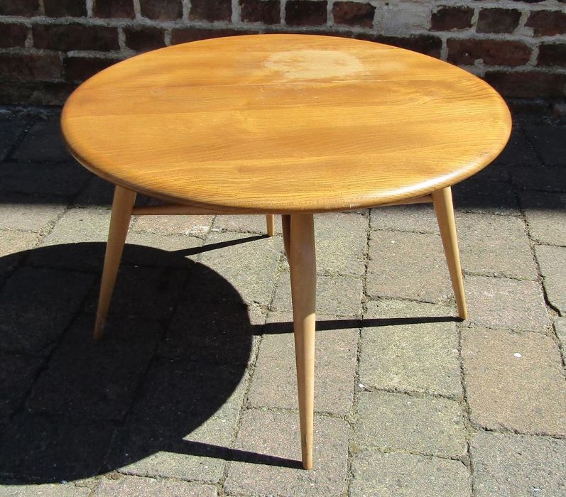 Small Ercol drop leaf table in light elm approx. 40cm high & 60cm diam.