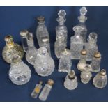 Selection of cut glass scent / condiment bottles - some with silver collars / lids
