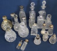 Selection of cut glass scent / condiment bottles - some with silver collars / lids