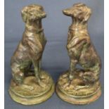 Pair of seated bronze greyhounds on circular bases after Barye, height 17cm