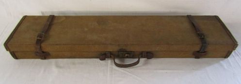 Canvas covered gun case with leather straps and red felt lining