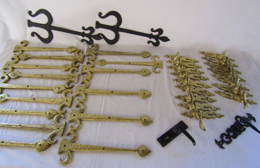 Large collection of brass hinge plates and scroll door handles also includes a set of iron hinge