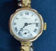 Ladies wristwatch in a 9ct gold case with plated with white dial marked Bortners
