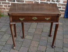 Georgian mahogany fold over card table with counter wells on pad feet