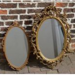 2 ornate oval wall mirrors, largest 90cm x 56cm