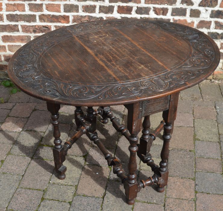 Oak gate leg table with carved top, 106cm x 86cm