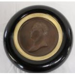 Bronze portrait roundel depicting Napoleon marked Andrieu in circular ebonised frame, diameter 23cm