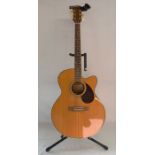 Freshman electro acoustic guitar with stand, tuner & capo