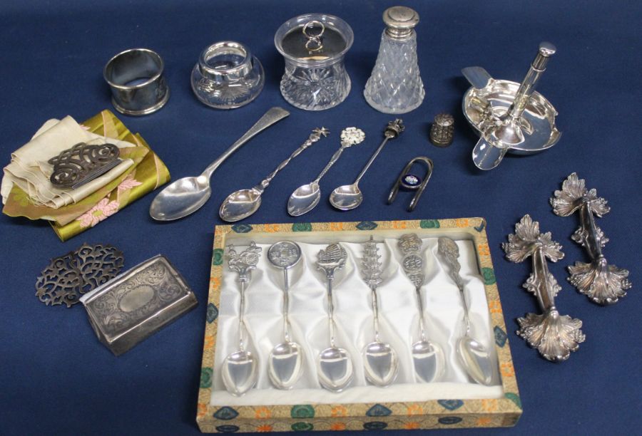 Selection of silver including commemorative spoons, napkin ring, ashtray (damaged), nurses buckle,