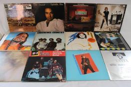 Collection of vinyl records including David Edmunds, Rolling Stones, Crystal Gale, John Fogerty,