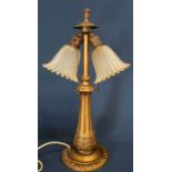 Decorative twin lamp table lamp with frosted glass shades and acanthus leaf decoration to lamp base