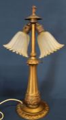 Decorative twin lamp table lamp with frosted glass shades and acanthus leaf decoration to lamp base