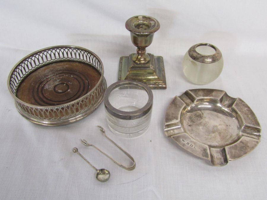 Selection of silver items to include a silver ashtray (1.86 ozt), match striker, wine holder,
