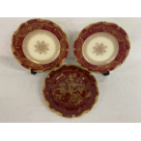 Three Coalport red cabinet plates with gilding - one with bird design approx. 27cm