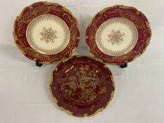 Three Coalport red cabinet plates with gilding - one with bird design approx. 27cm