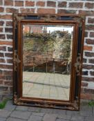 Large ornate gilt and ebonised wall mirror, 118cm x 86cm