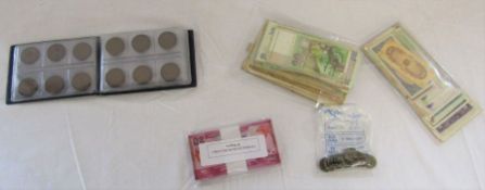 Selection of British coins, including one pence and threepence and foreign bank notes