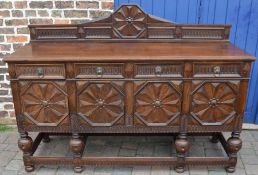 Large early 20th century heavily carved oak side board, L184cm x D60cm x H131cm