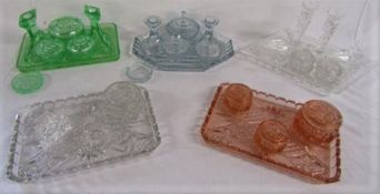 Collection of clear and coloured glass dressing table sets