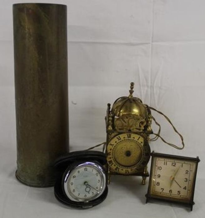 1917 brass shell casing, Smith brass electric lantern clock and 2 travelling clocks